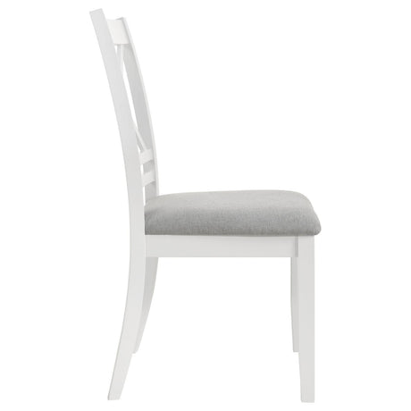 Comfortable seat cushion on white wood chair