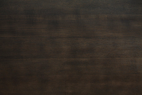 Close-up detail of crafted table surface and chair upholstery