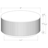 Round coffee table in living room setting, white marble top