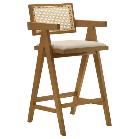 Kane solid wood bar stool with woven rattan back and upholstered seat in light walnut - front view