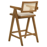 Set of two Kane light walnut bar stools with woven rattan backs
