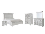 Side view of Kanwyn Whitewash Panel Storage Bedroom Set bed