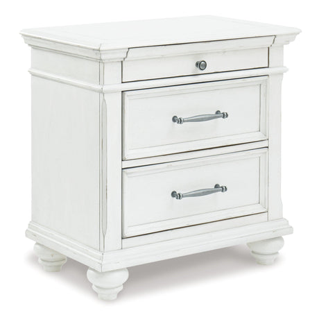 Side perspective of Kanwyn Whitewash Panel Storage Bedroom Set bed