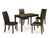 Close-up of cushioned dark brown faux leather chairs