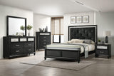 Close-up of tufted black velvet headboard on Lila full bed
