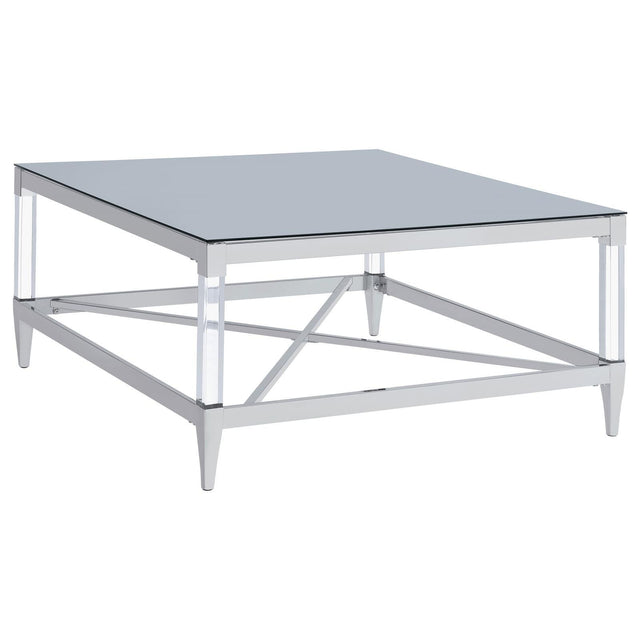Lindley square coffee table with tempered mirror top and acrylic legs angled view