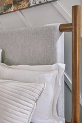 Lyncott Brown Queen Upholstered Panel Bed footboard view