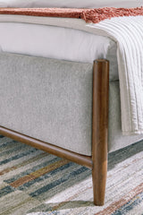 Elegant brown finish on solid wood frame of Lyncott bed