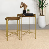 Close-up of Malka round nesting table gold iron base with X-brace