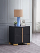Side angle of Marceline black 2-drawer nightstand highlighting geometric gold accents