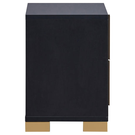 Close-up of dresser mirror with black frame and gold accent