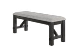 Close-up of charcoal fabric upholstered dining chair with wheat wood legs