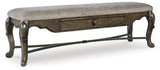 Side angle showing ornate cabriole legs and dark brown finish