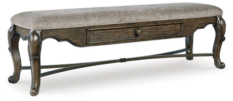 Side angle showing ornate cabriole legs and dark brown finish
