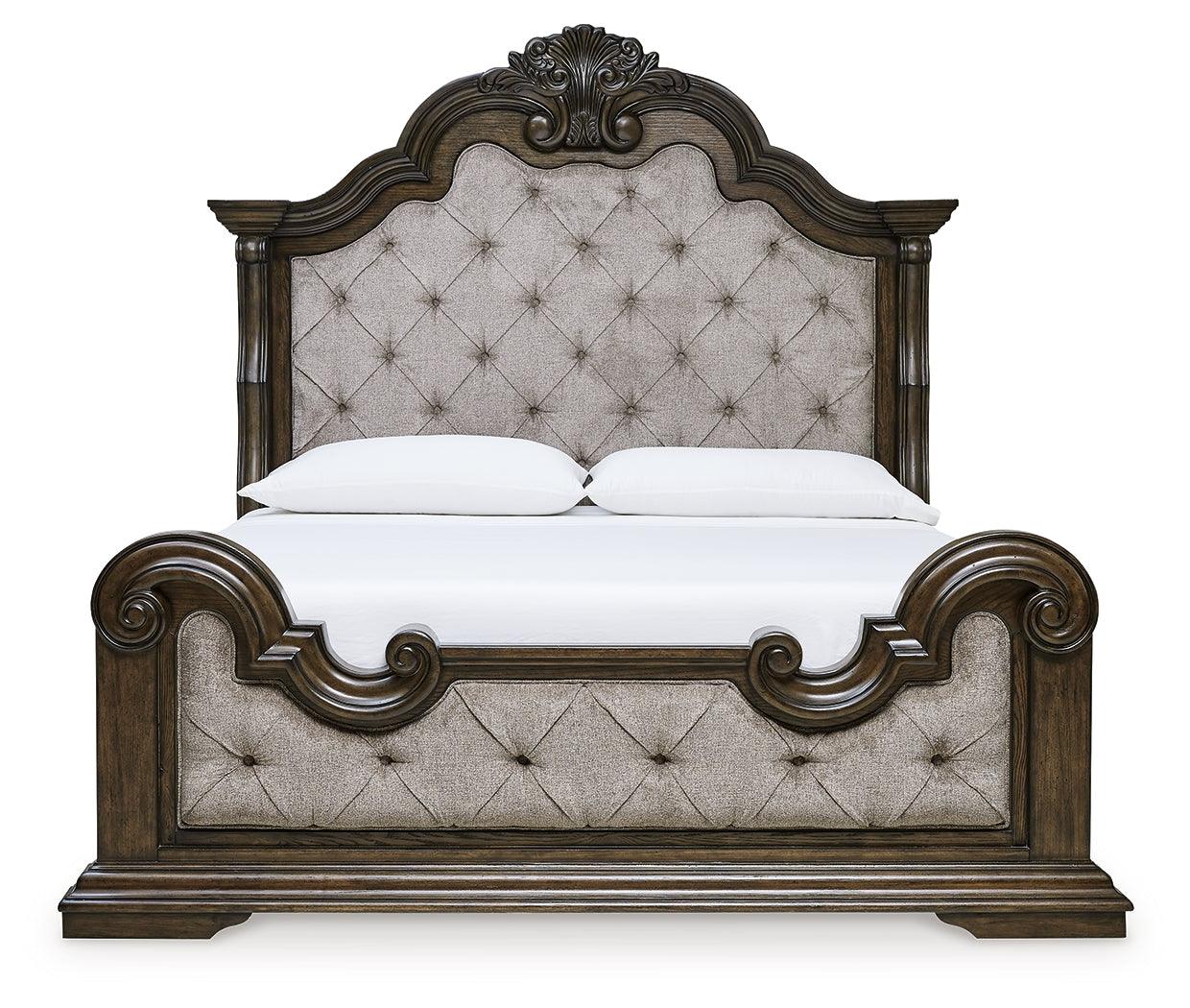 Dark brown king panel bed showcasing tufting