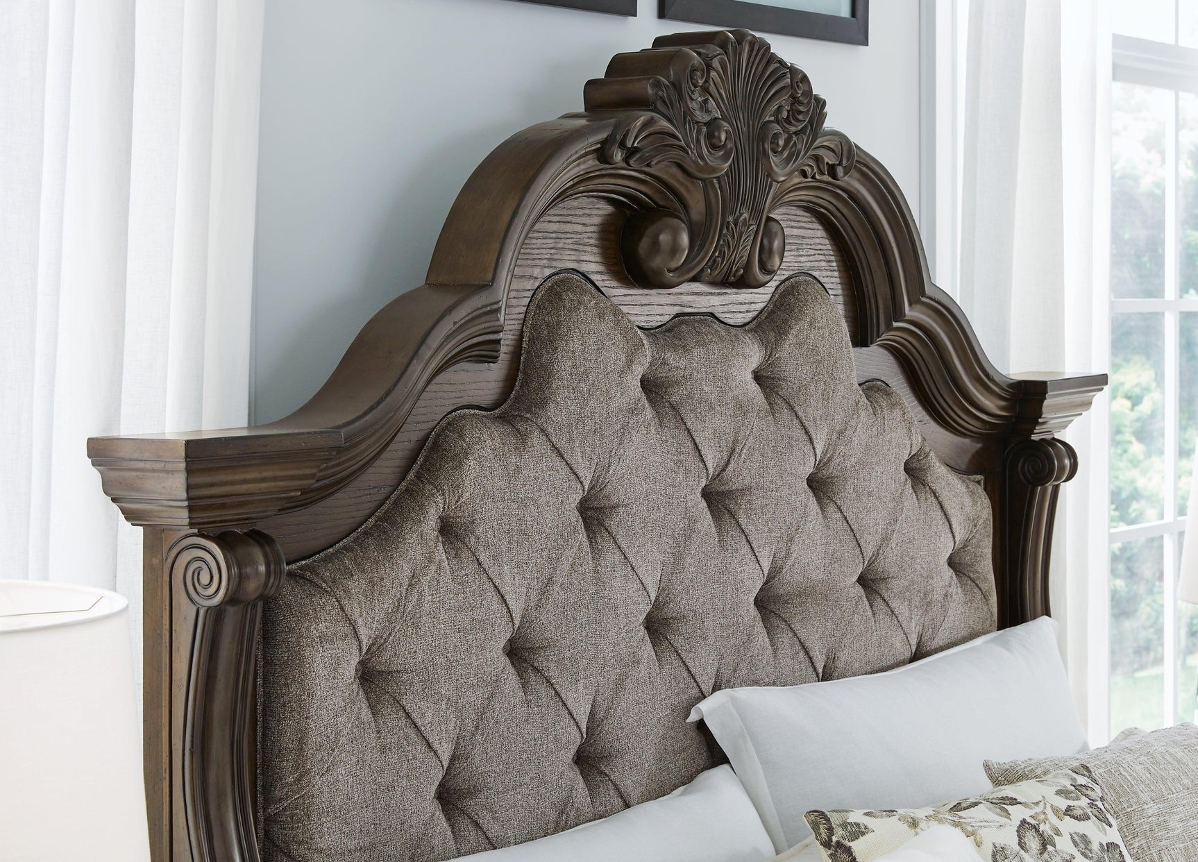 Side perspective of Maylee dark brown king bed