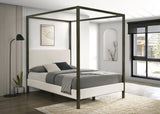 Front angle of Monroe Eastern King Upholstered Canopy Platform Bed in vanilla fabric and bronze frame