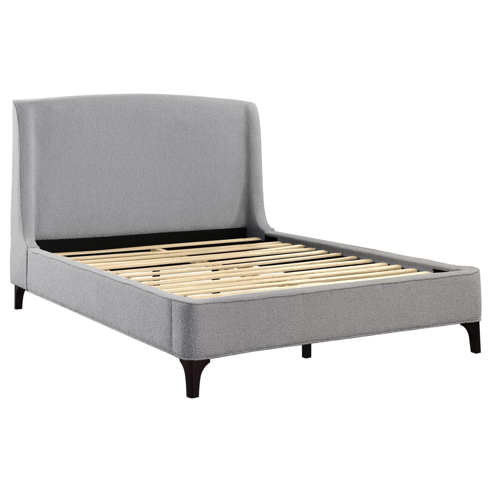Close-up of curved light grey upholstered headboard on Mosby King bed