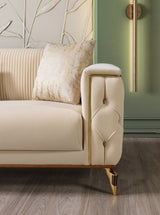Angle view of sofa and loveseat in ivory velvet