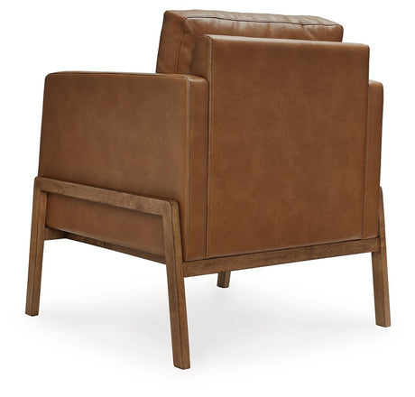 Numund accent chair close-up of caramel faux leather upholstery