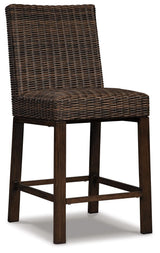 Outdoor bar table set positioned in backyard environment