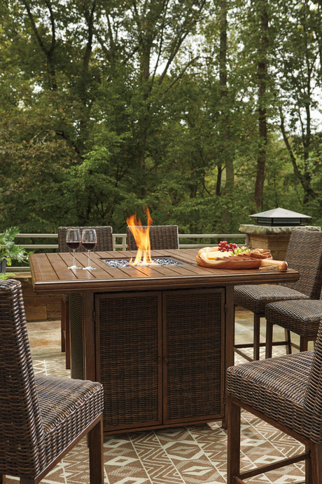 Side angle of outdoor bar table showing wood-look finish and wicker accents