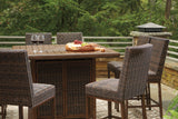 Side view showing handwoven resin wicker and wood-look table legs