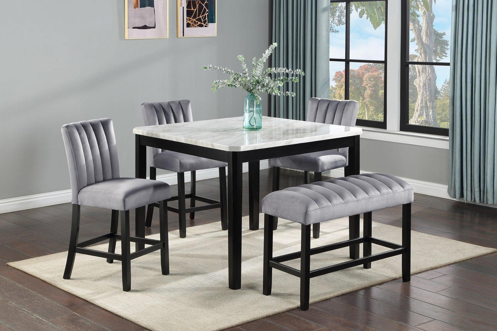 Side angle of Pascal faux marble top table with velvet upholstered chairs