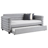 Patricia daybed trundle pulled out, showing twin mattress in grey upholstery