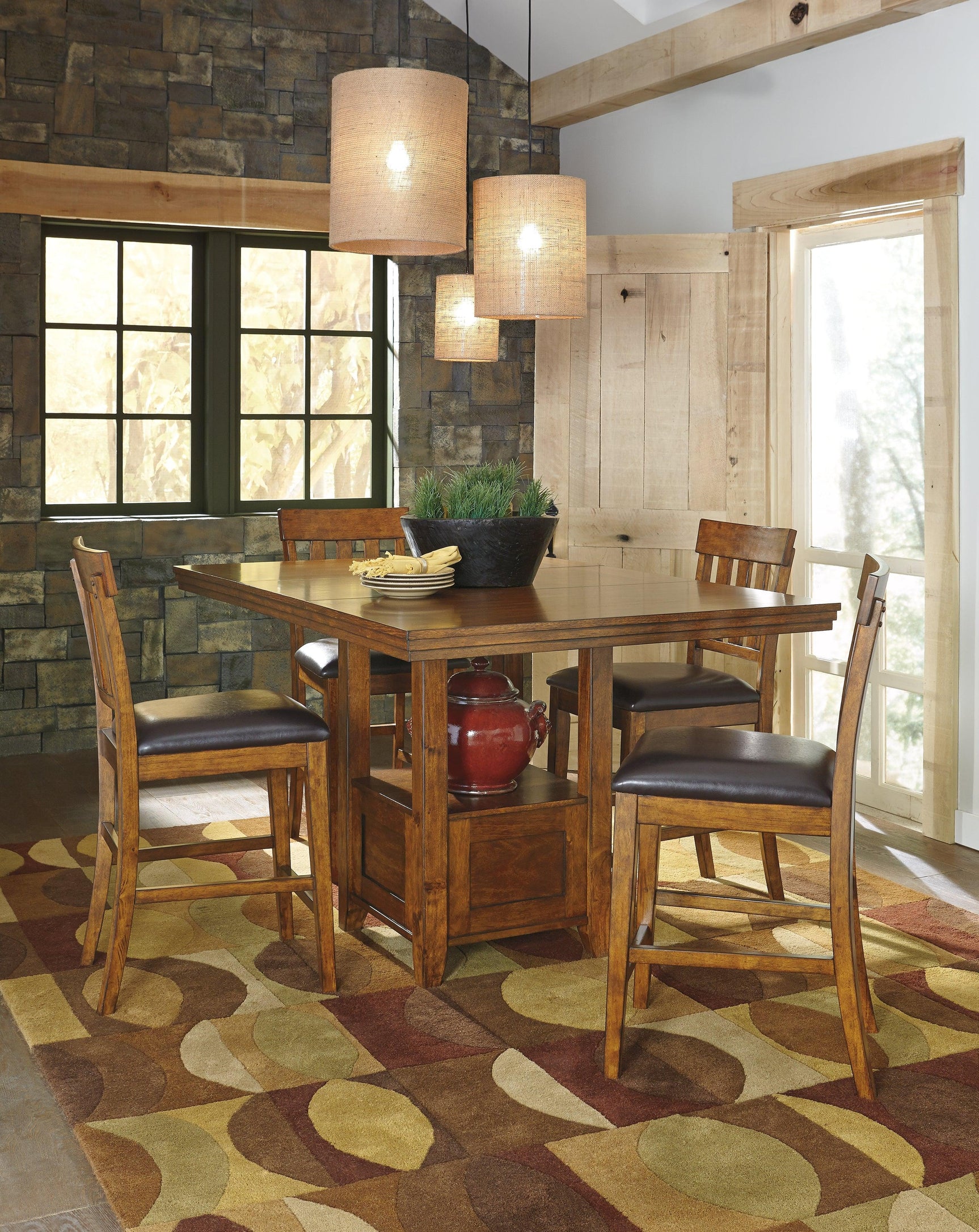 Ralene dining set counter height table and barstools from side