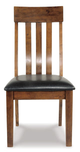 Main view of Ralene dining table with upholstered chairs