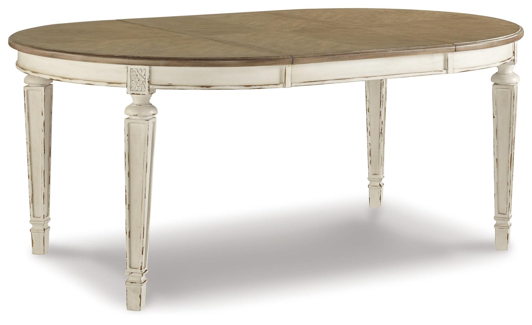 Set detail showing chipped white finish and chair upholstery