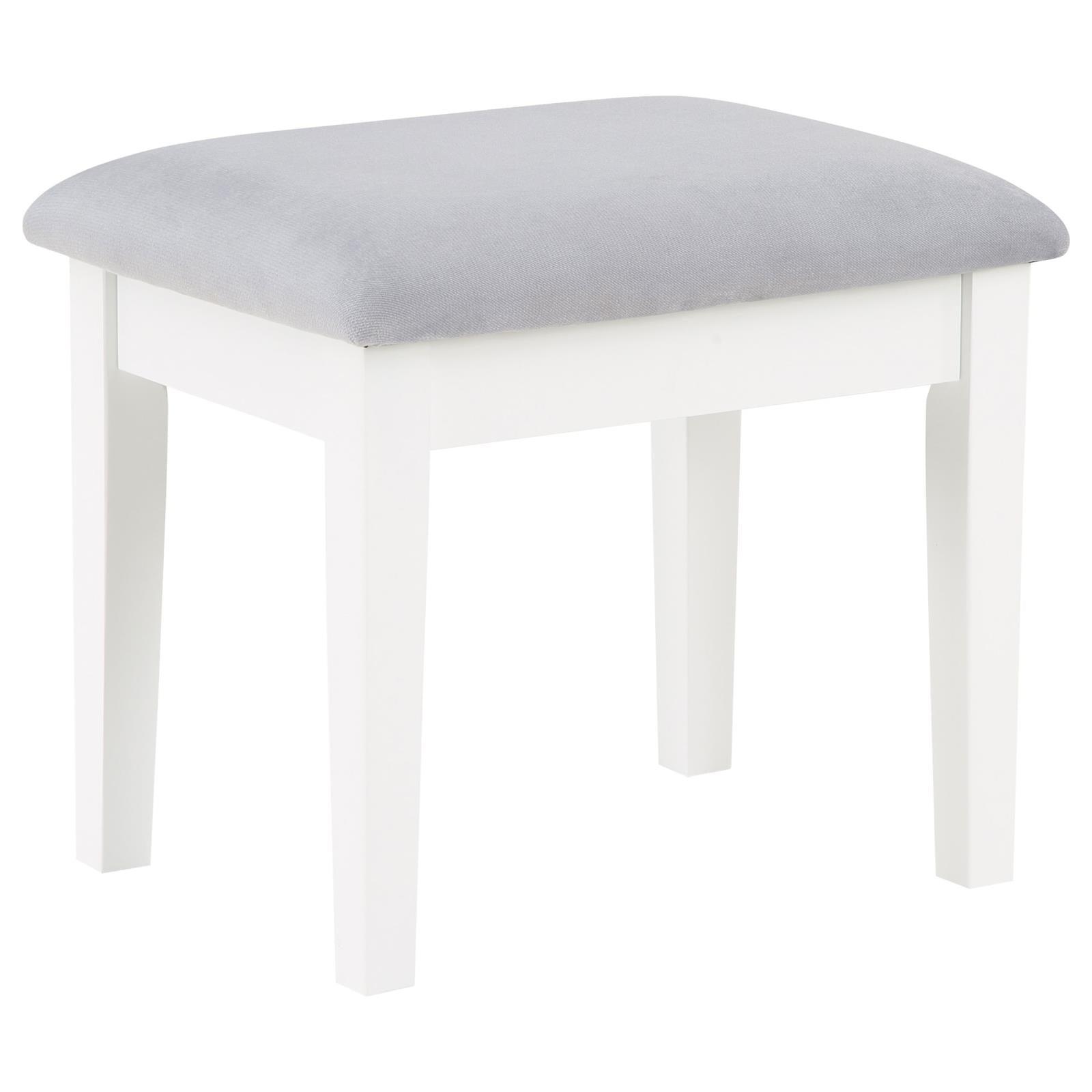 Gray fabric cushioned stool under vanity table
