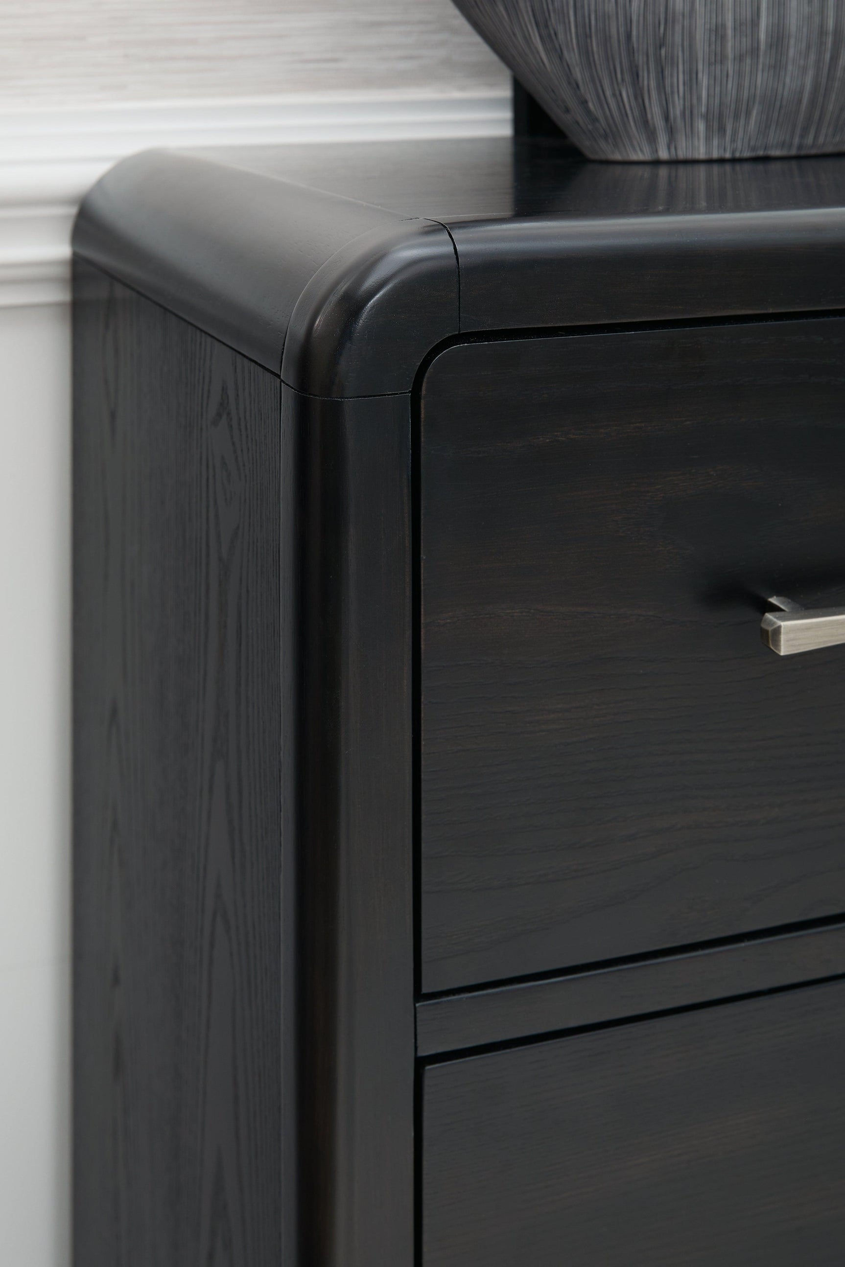 Rowanbeck Black Dresser textured wood grain surface