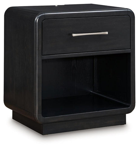Side angle of Rowanbeck Black Nightstand showing curved silhouette