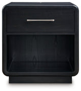 Open drawer of Rowanbeck Nightstand displaying smooth gliding and fully finished interior