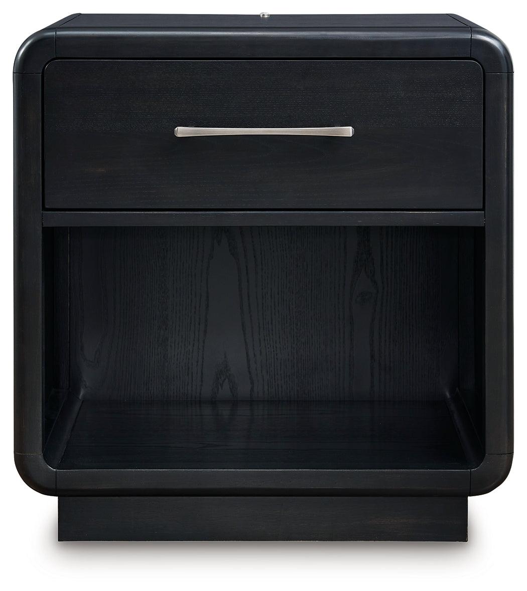 Open drawer of Rowanbeck Nightstand displaying smooth gliding and fully finished interior