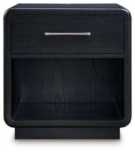 Open drawer of Rowanbeck Nightstand displaying smooth gliding and fully finished interior