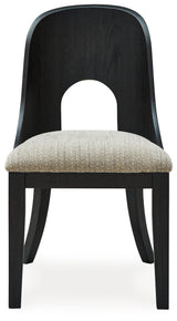 Dining chair showing black wood legs and curved backrest