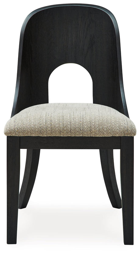 Dining chair showing black wood legs and curved backrest