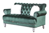 Close-up of green velvet tufted upholstery on sofa and loveseat