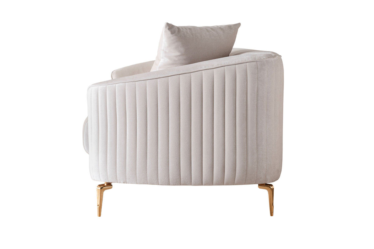 Detail view of sofa armrest and velvet texture