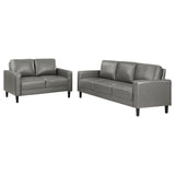 side angle of Ruth 2-Piece grey faux leather sofa and loveseat set