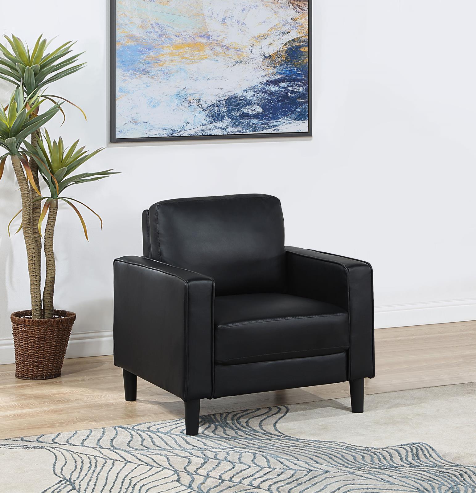 Side view of Ruth accent chair with black leatherette upholstery