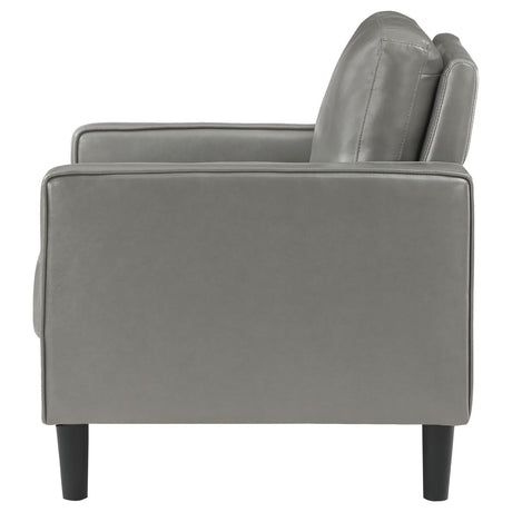 Side detail of Ruth Grey Faux Leather Accent Chair armrest