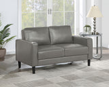 Side view of Ruth Loveseat highlighting plush cushions and tapered legs