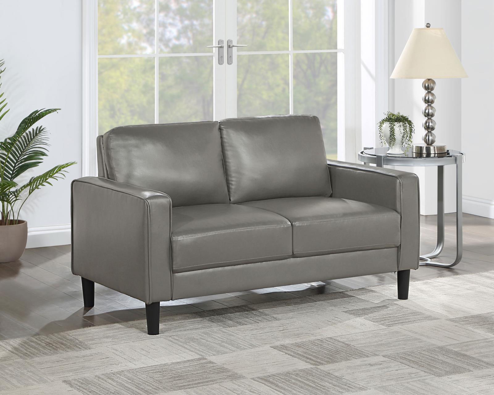 Side view of Ruth Loveseat highlighting plush cushions and tapered legs