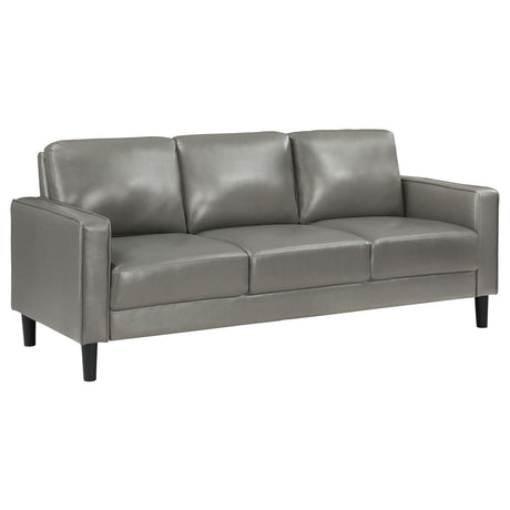 main view of Ruth grey faux leather upholstered sofa with track arms