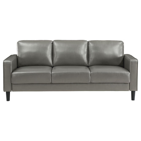 close-up of grey faux leather upholstery on Ruth sofa arm