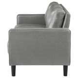 side angle of Ruth grey faux leather sofa showing seat cushions